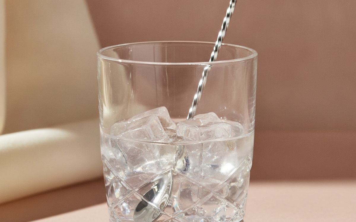 A mixing glass and long bar spoon