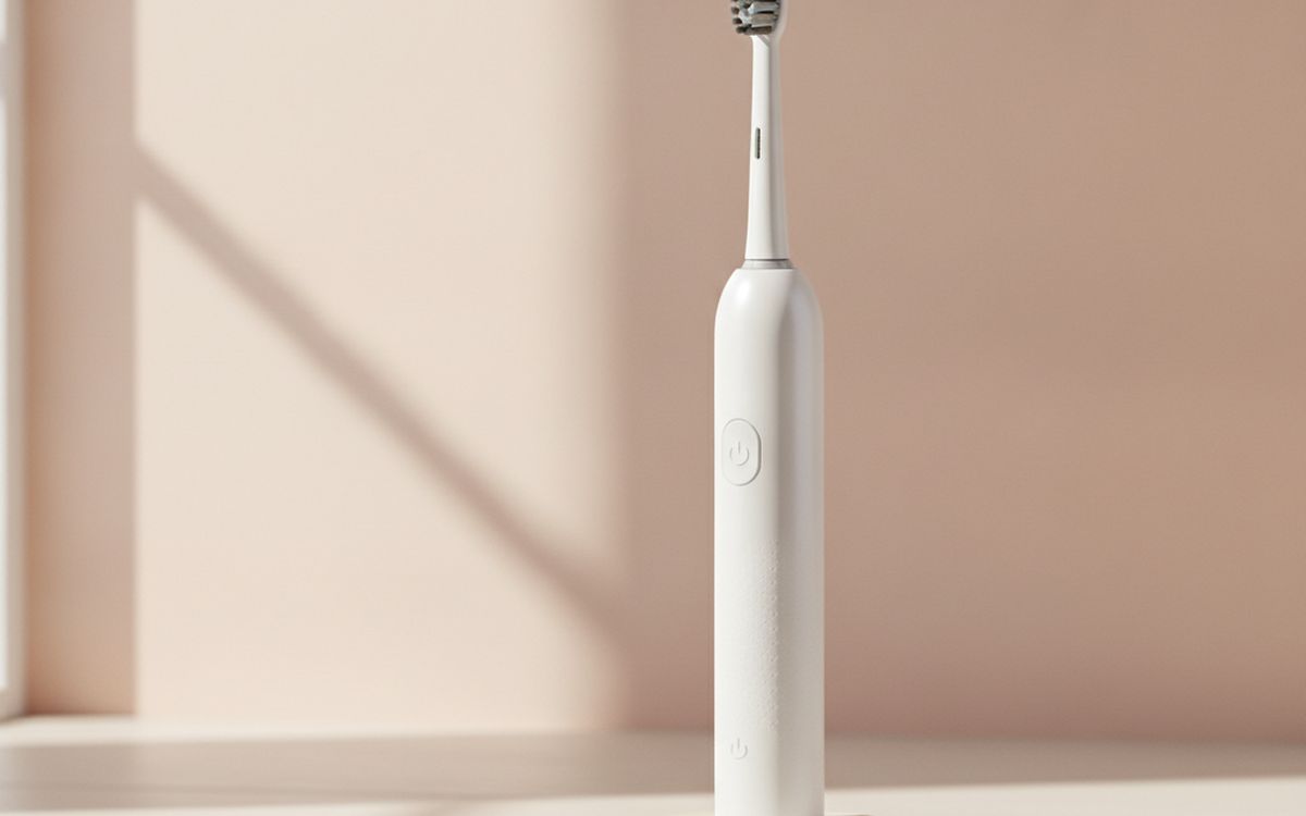 An electric toothbrush with timer and pressure sensor